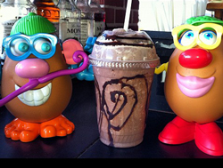 mr and mrs potato head with a cold coffee drink