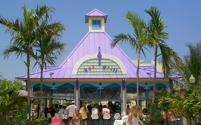 purple roof cabana with people at the bar